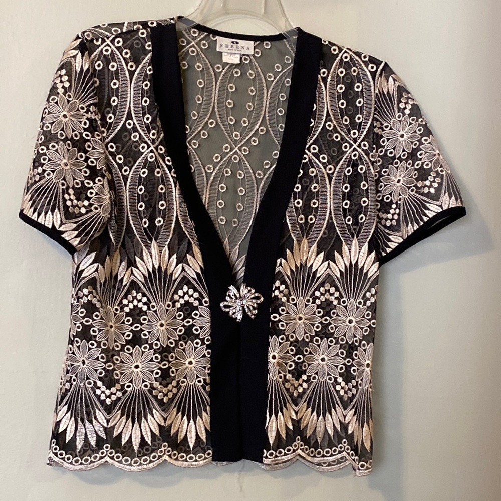 Sheena, sheer embroidered brocaded evening jacket, rhinestone clasp